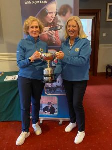 2 ladies with trophy